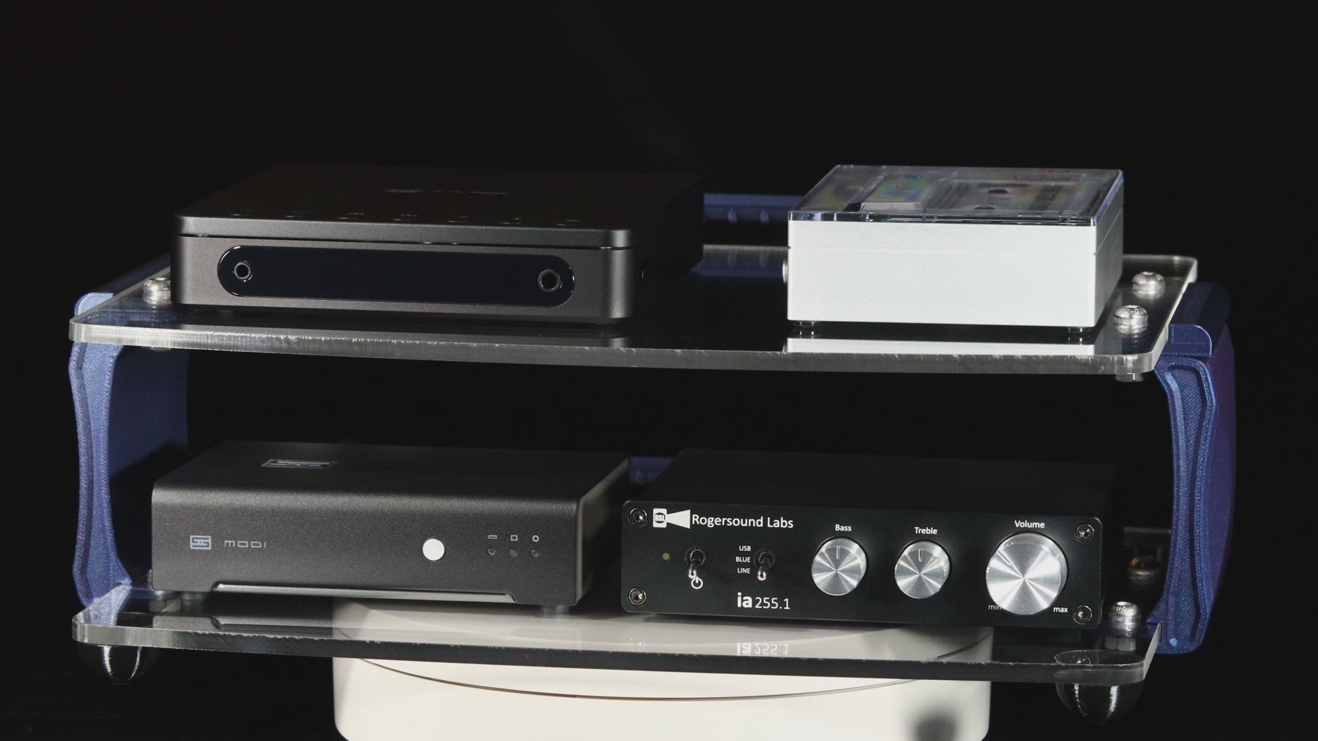 video of a desktop audio rack with 2 acrylic shelves and blue brackets